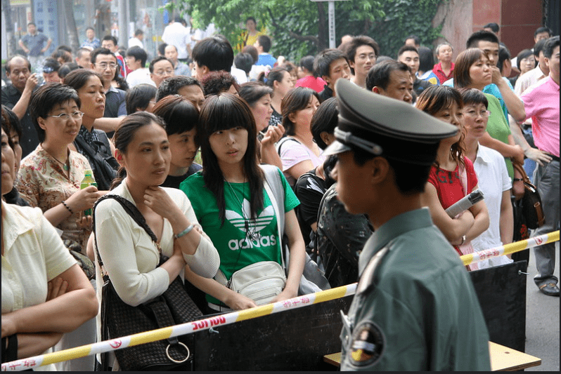Parents wait to see their children after the Chinese Gaokao at the heart of the Better Days film