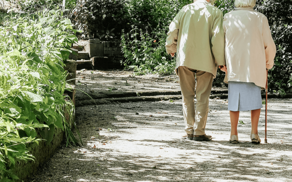 This is an elderly couple walking by what looks like a garden. This represents how the bias and perceptions that the larger public holds about old age are subverted in "Grace and Frankie".