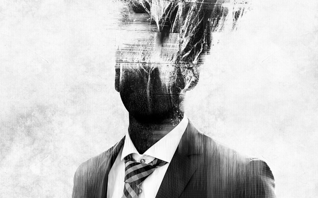This is a black and white graphic of an indistinguishable man in a suit with  a layered effect at the top of the man's head, fading into a shadowed face, signifying mental distress. This is used to represent the existential malaise of Rust and Marty in "True Detective" season one.